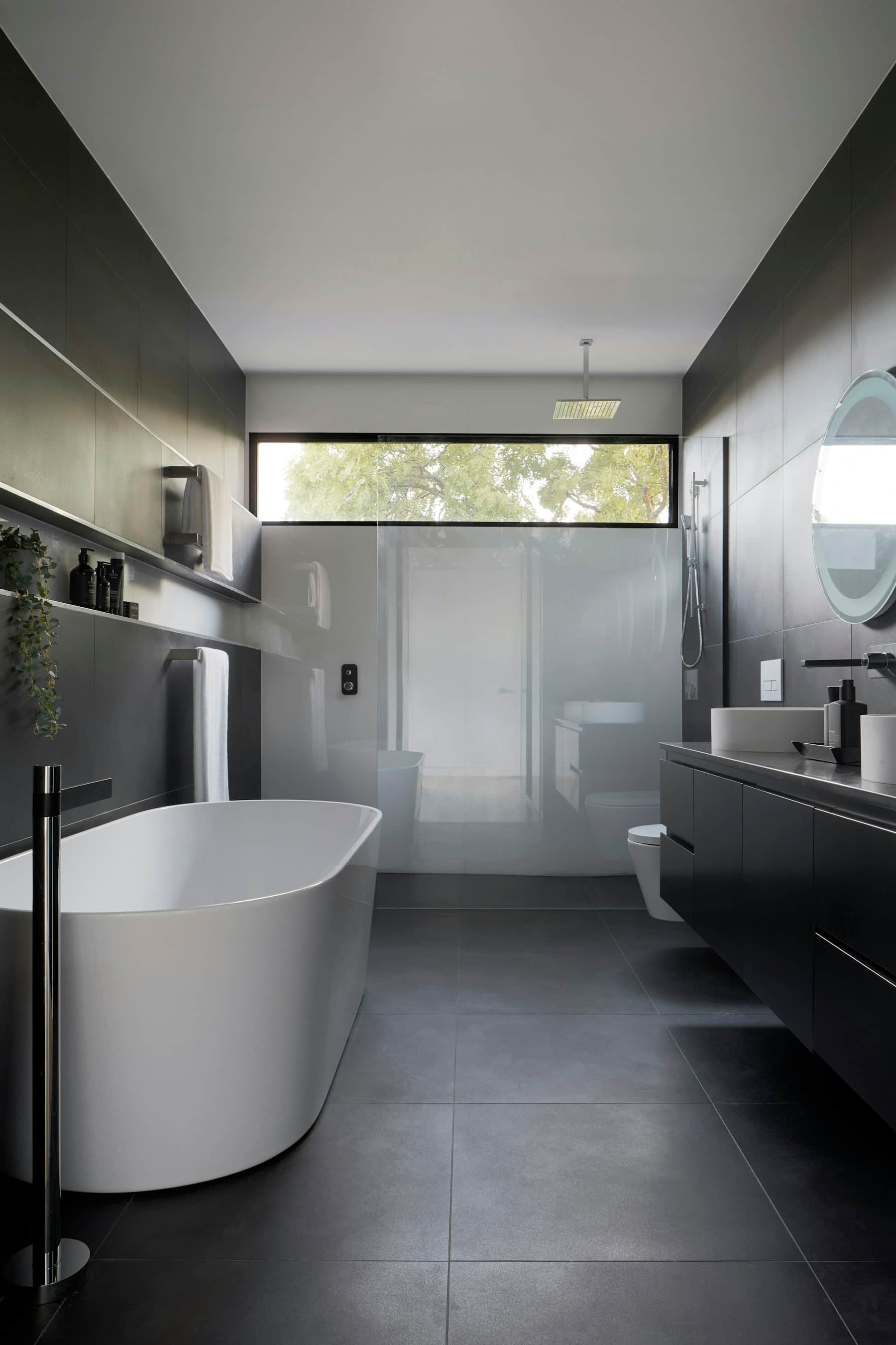 Modern bathroom finished with smooth microcement surfaces