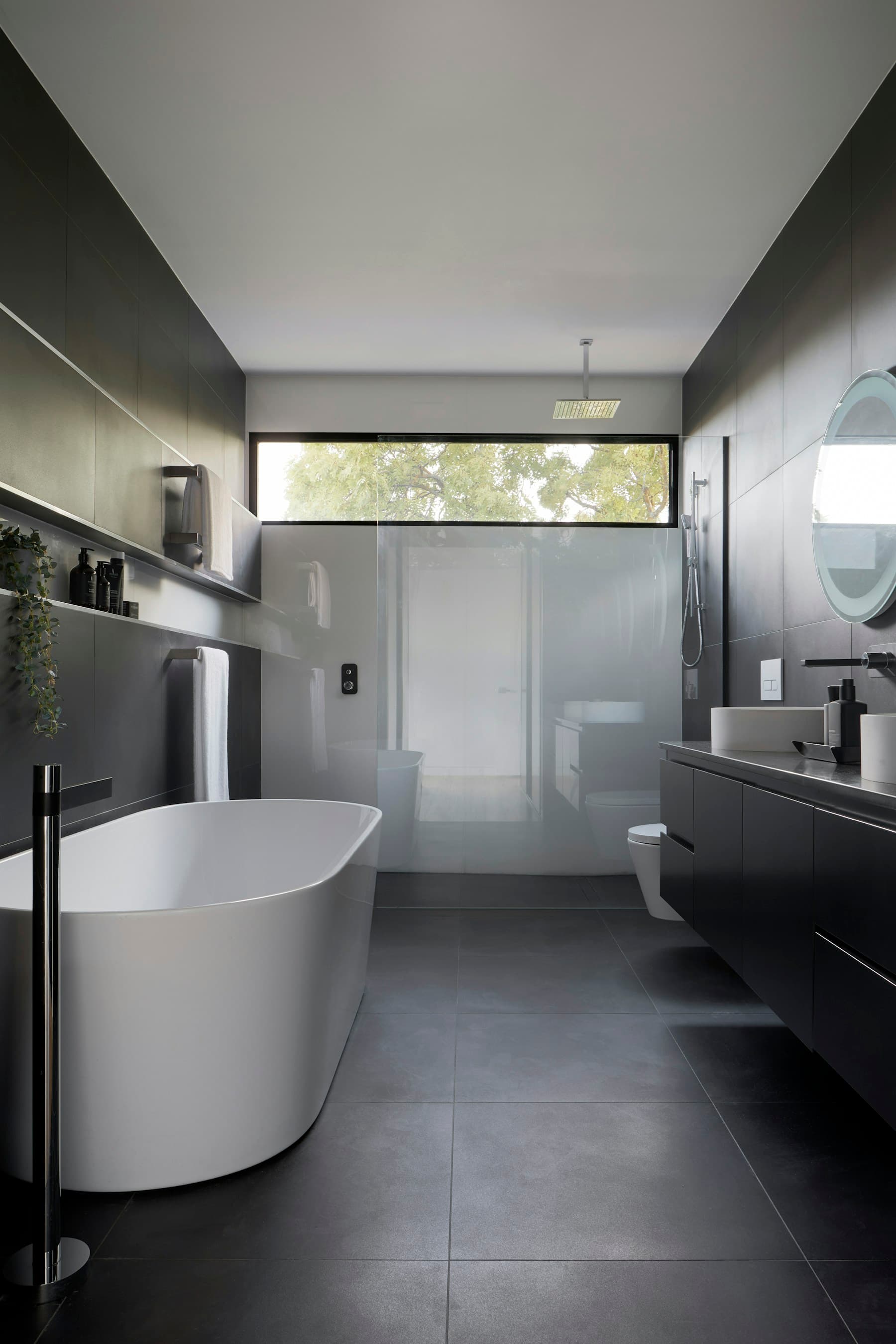 Smooth microcement-style surfaces in a modern bathroom