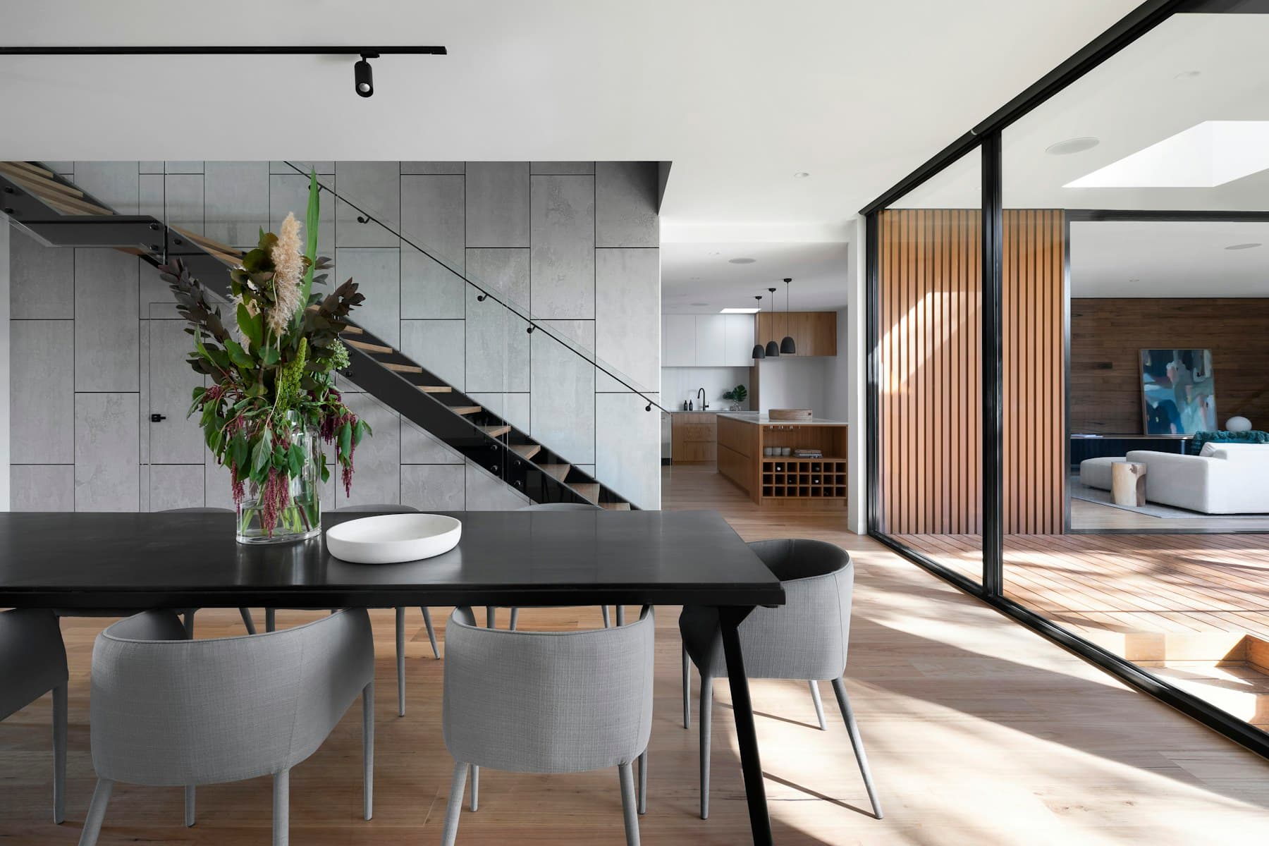 Large-format floor tile installed in a bright contemporary living room
